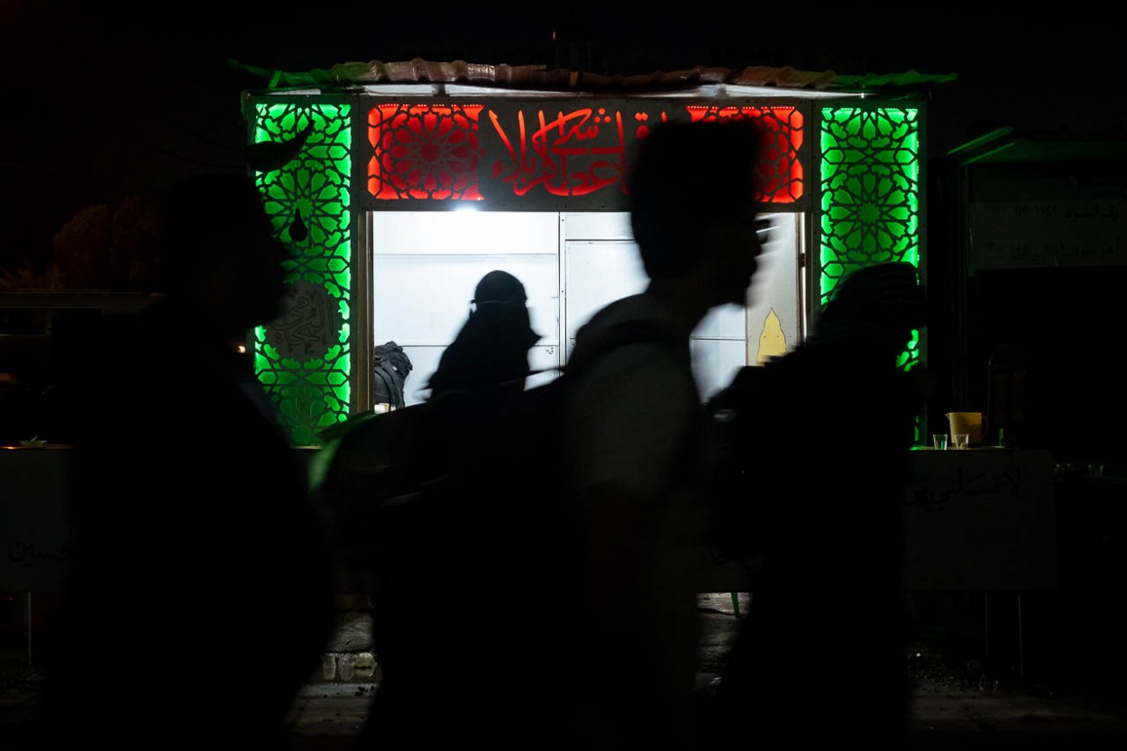 Some pilgrims walk together to Karbala even at night, when temperatures drop dramatically