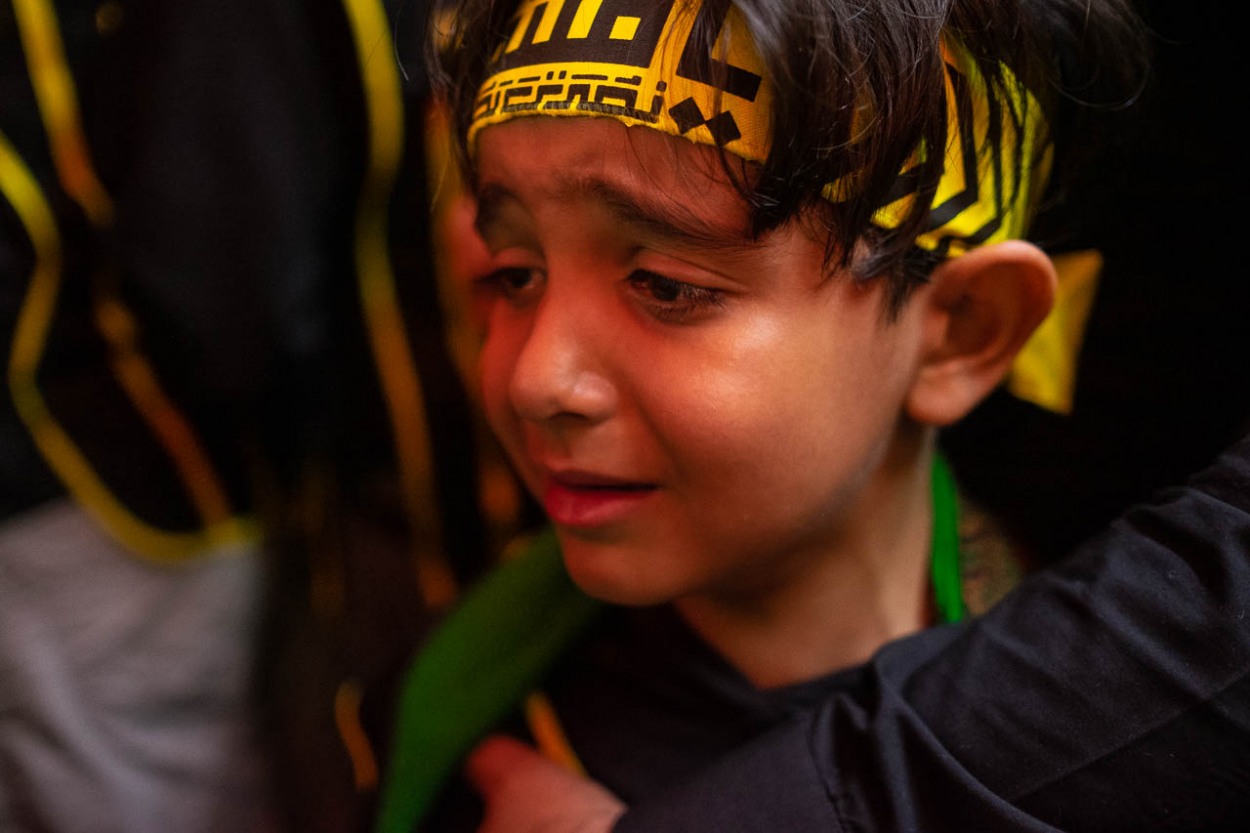 A young brother of Heyat Honar brotherhood express his pain and suffering inside the mausoleum of Imam Hussein in Karbala, Iraq