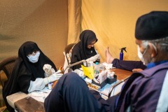 One of the most impressive facts about Arbaeen pilgrimage is to see how thousands of people help the pilgrims altruistically. In this case, two nurses treating the damaged feet of two pilgrims