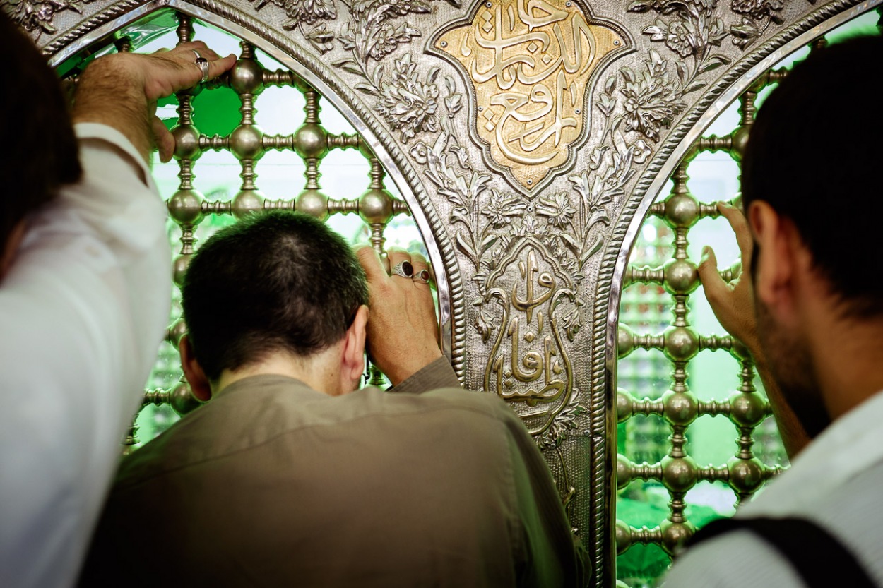 Mikail praying at Imam Reza Shrine